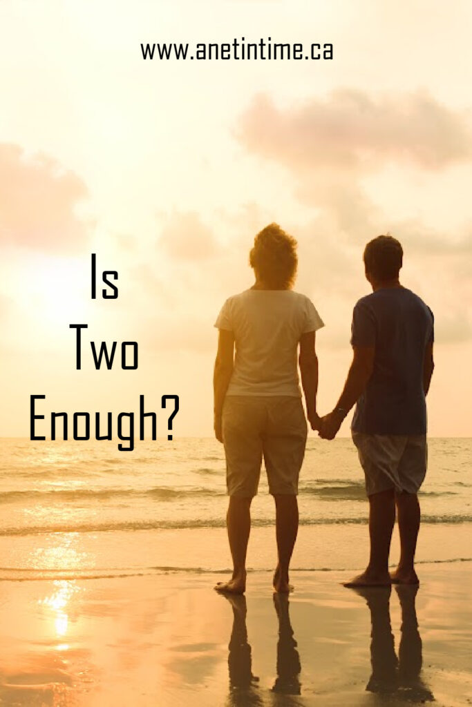 is two enough? text, image of couple standing on the beach in the morning