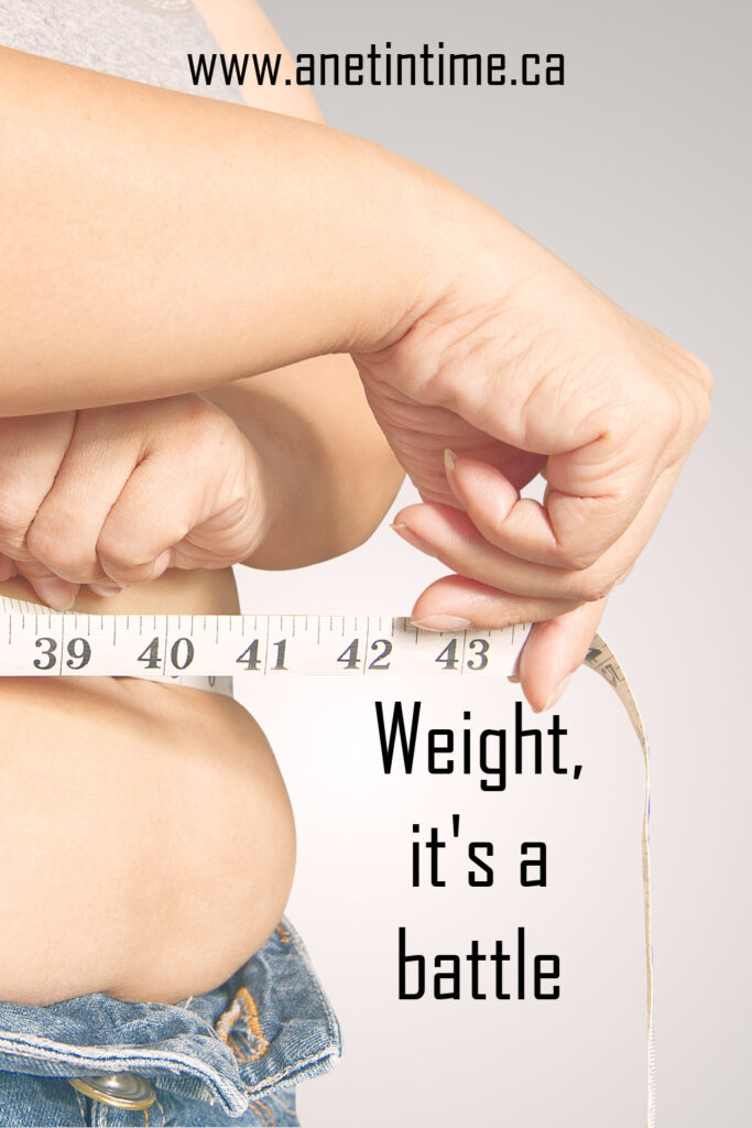 weight, it's a battle text.
image of person holding measuring tape to abdomen