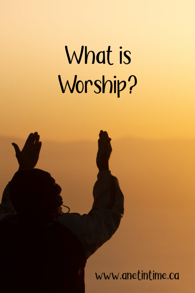text: what is worship
image: person standing against sunlight sky with hands upraised