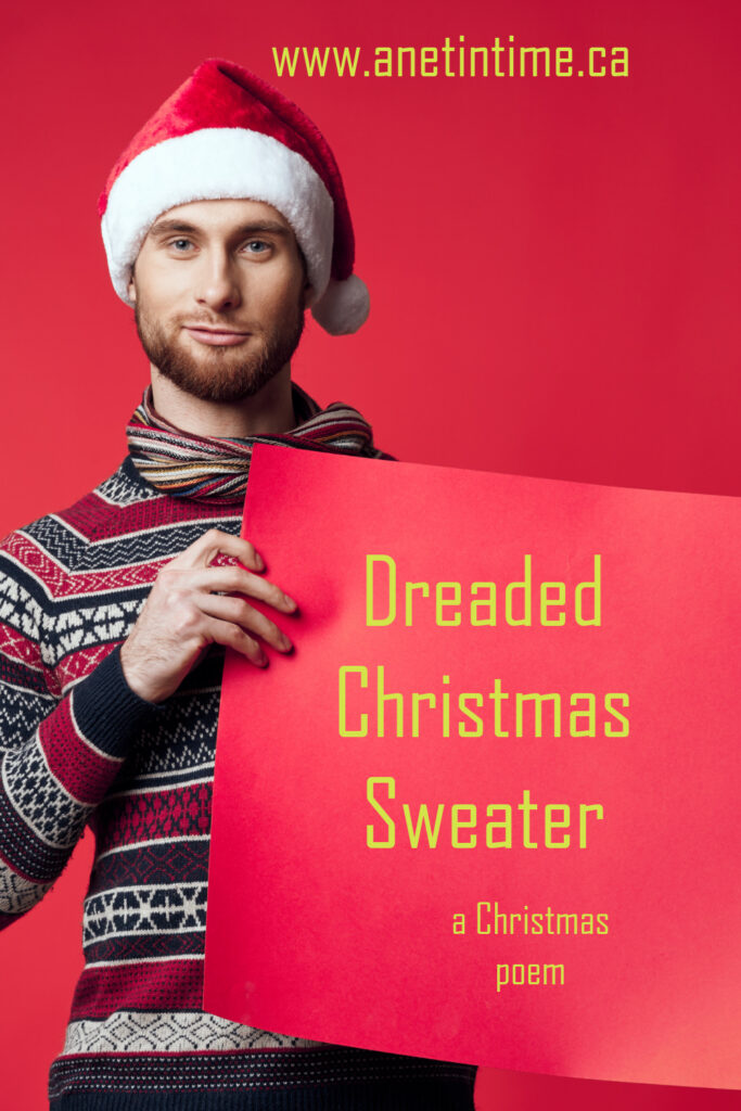 image of man in christmas sweater holding poster board.  Text Dreaded Christmas Sweater