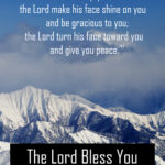 The Lord Bless You image of blue sky over snow covered mountains. Text: The Lord Bless You