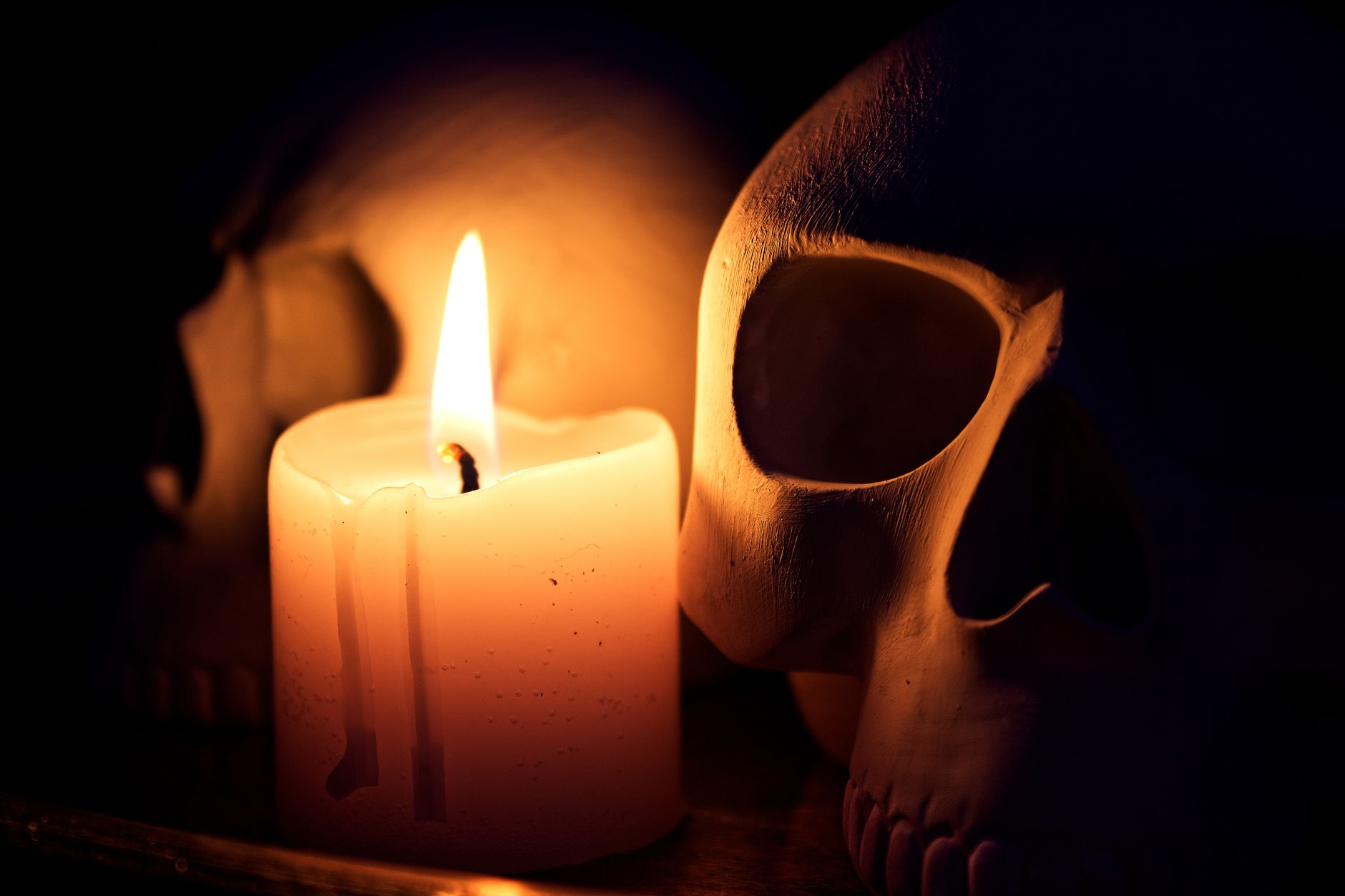 candlelight and skulls in dramatic still life